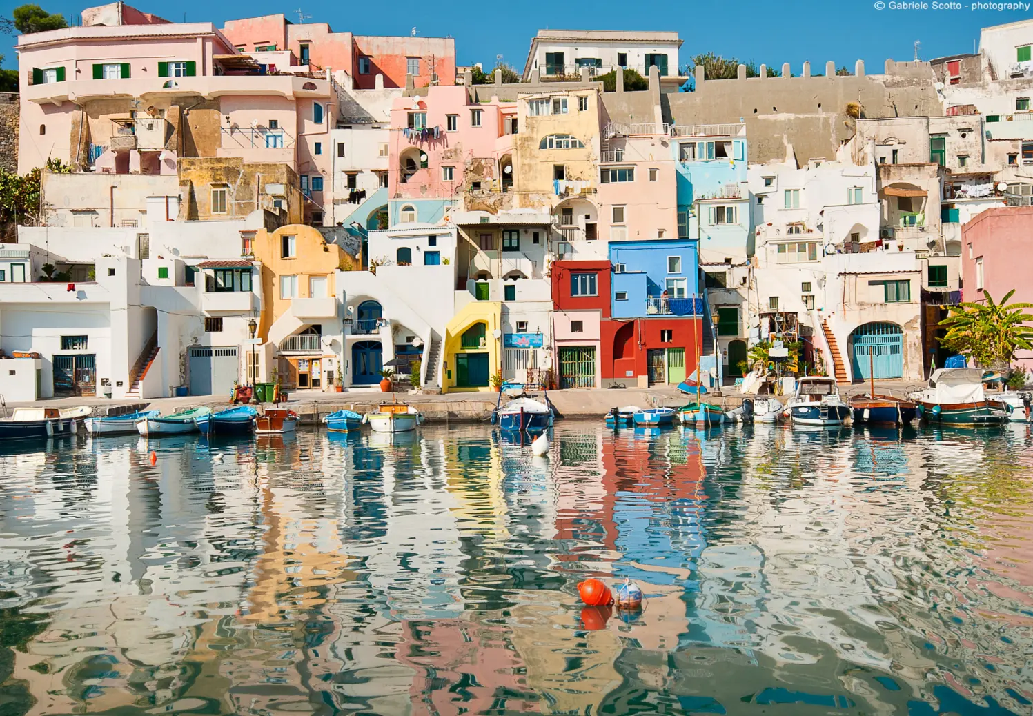 Pastel houses and fishing boats in Marina Corricella