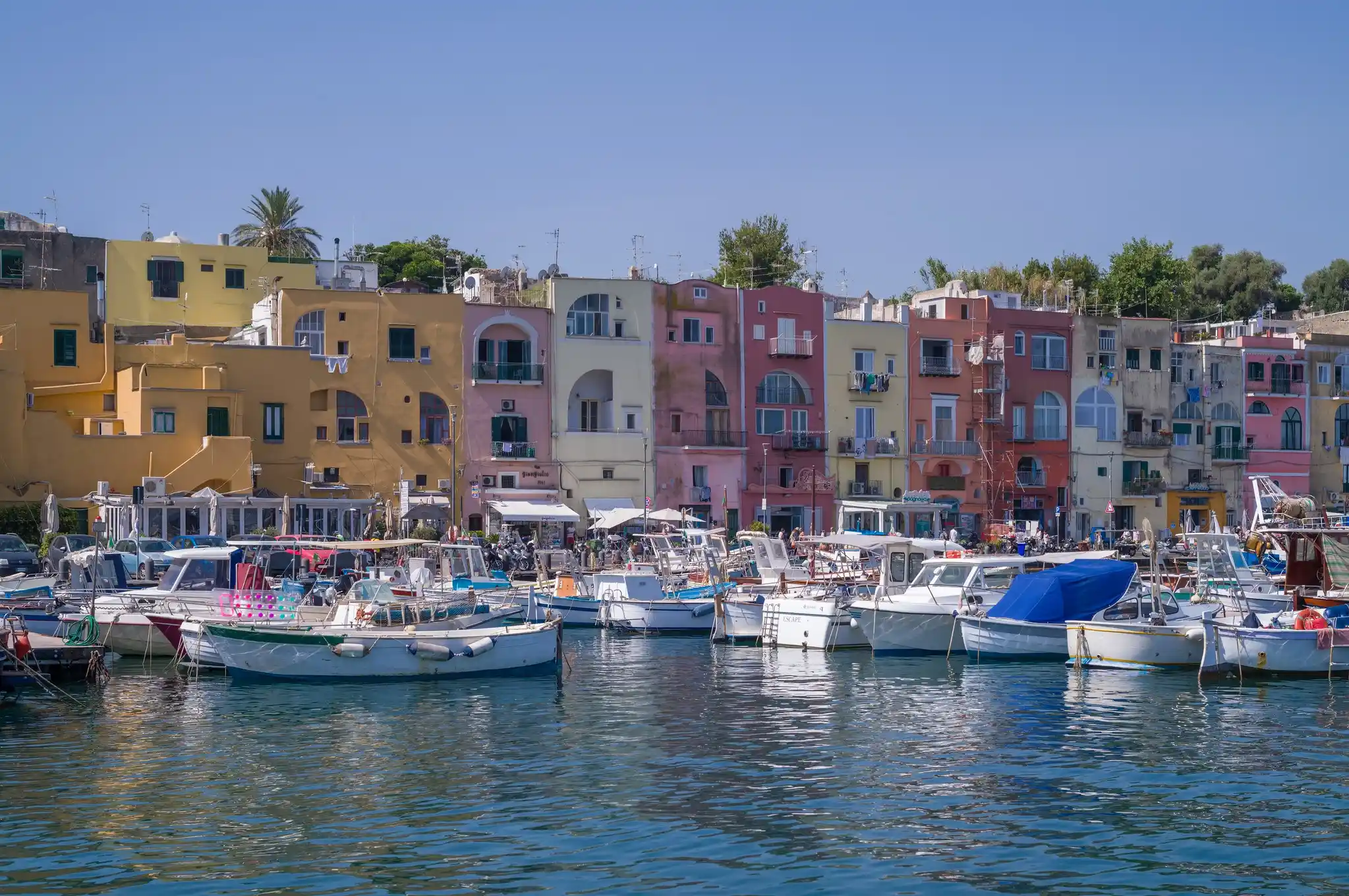 Via Roma in Procida with cafes and port atmosphere